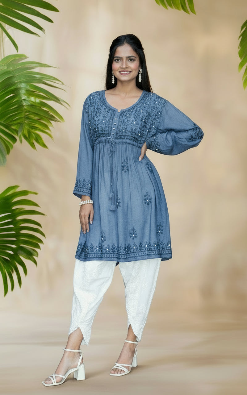 model wearing chikankari short kurti frock style with dhoti tulip trousers