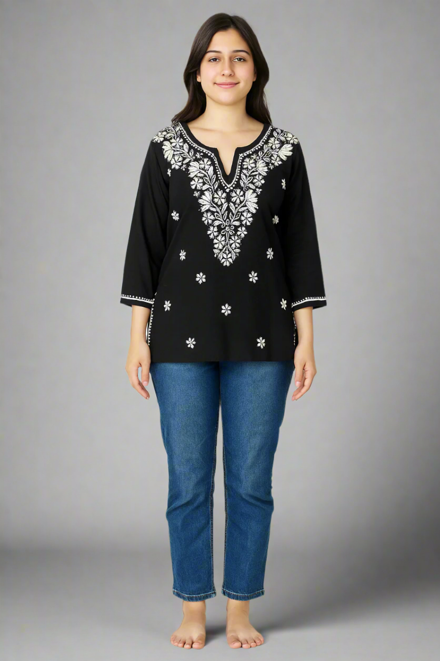 model wearing chikankari short black kurti and jeans