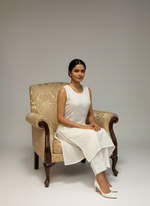 Model is wearing white chikankari muslin fabric summer sleeveless dress