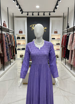 Purple textured garment on a mannequin