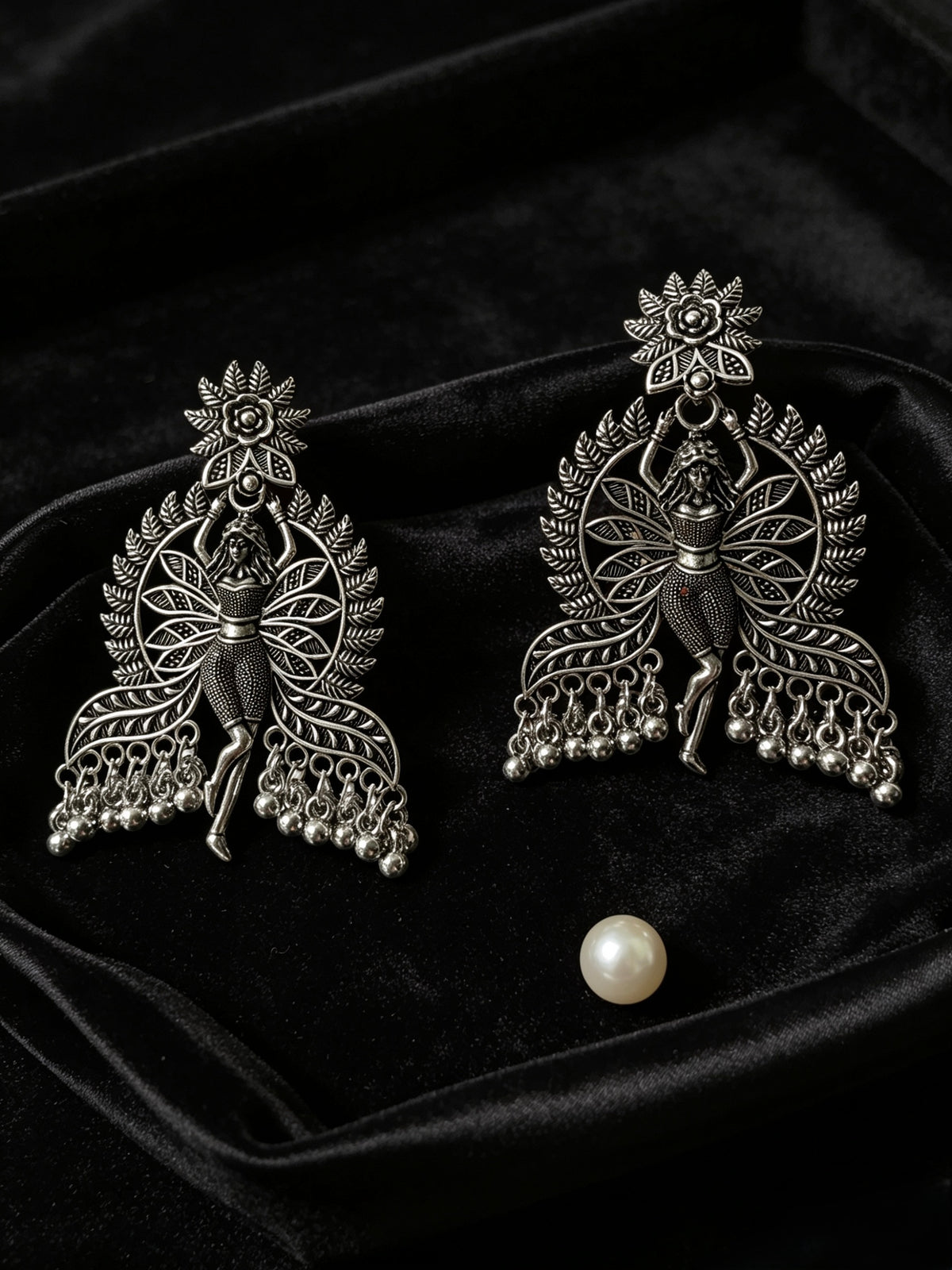 Rear view of dancing fairy doll oxidised silver statement earrings showing secure push-back closure and durable finish