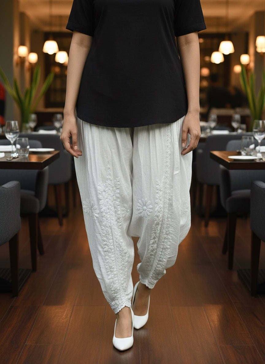 White Chikankari embroidery Dhoti Pants Tulip Trousers on mannequin