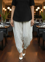 White Chikankari embroidery Dhoti Pants Tulip Trousers on mannequin