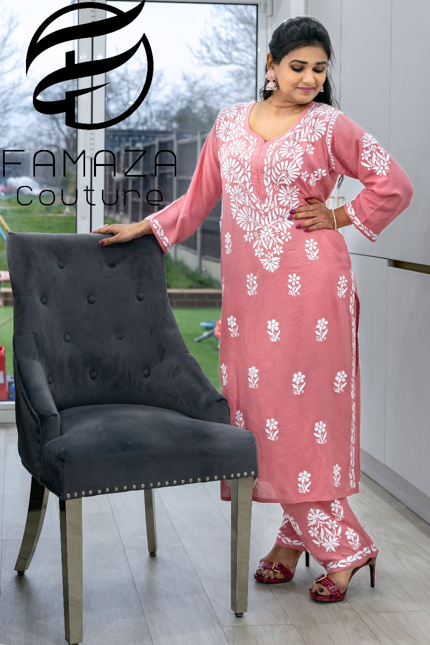 model wearing Floral chikankari kurti palazzo set in pink with white embroidery