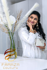 side view of model wearing Floral chikankari kurti palazzo set in white with white embroidery