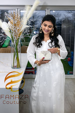 model wearing Floral chikankari kurti palazzo set in white with white embroidery