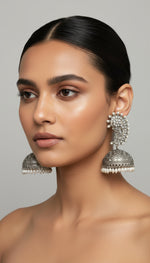 Silver earrings with intricate designs by famaza couture