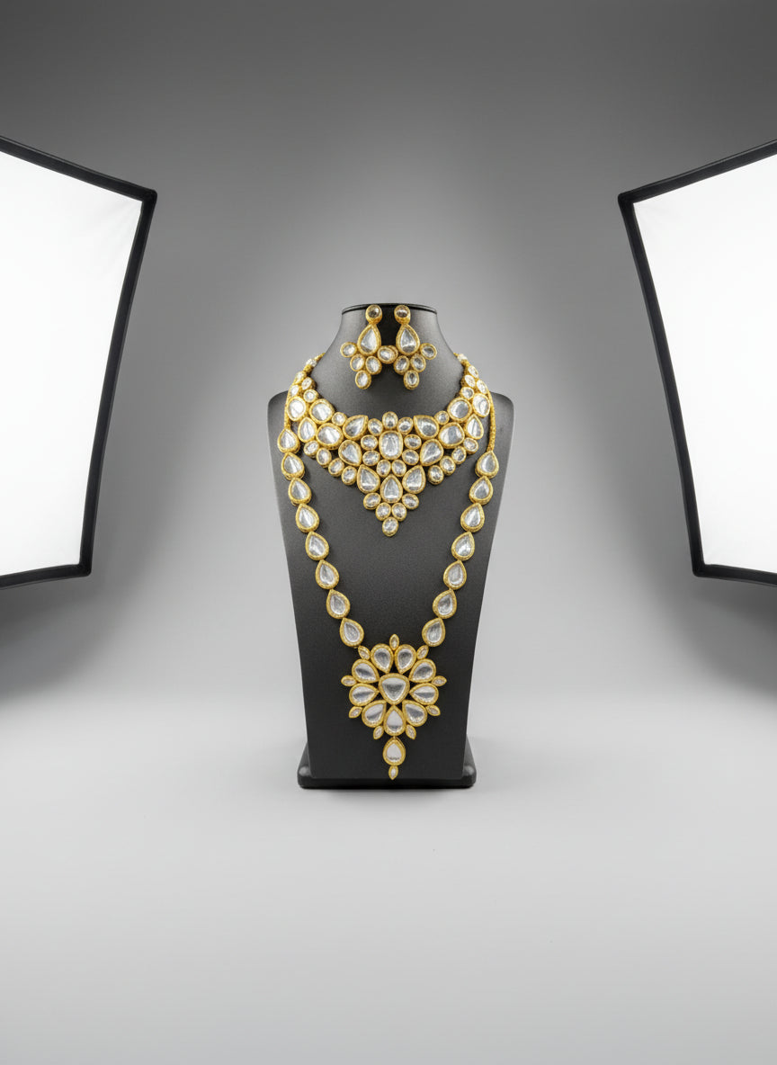 gold-toned Kundan oval choker necklace and mala necklace with polki kundan embellishments and matching earrings by famaza couture