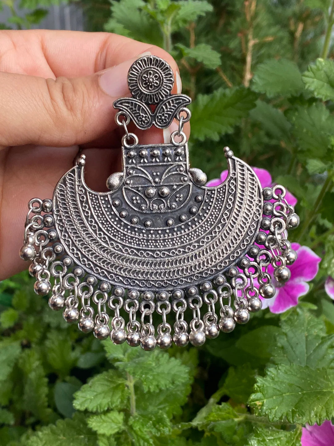 Oxidised metal chandbali earrings inspired by crescent moon design