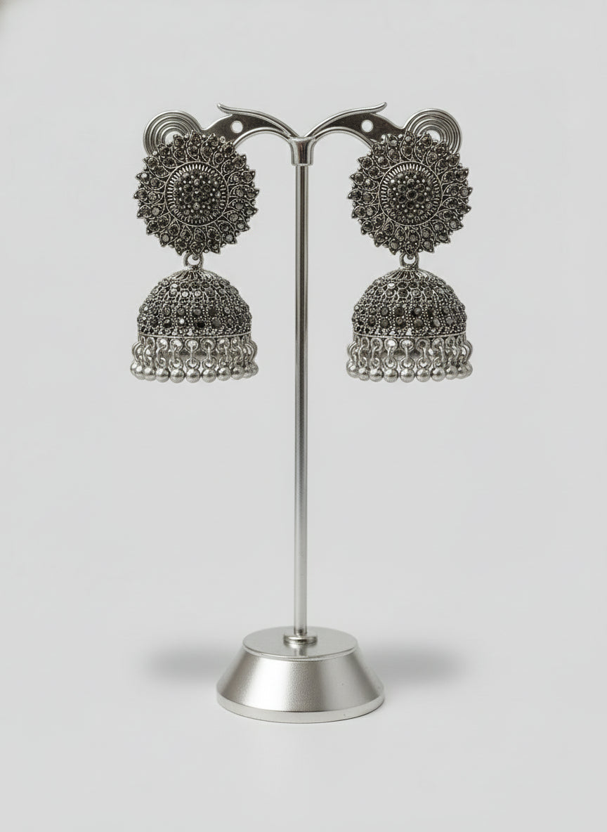 Silver oxidised jhumka earrings close up