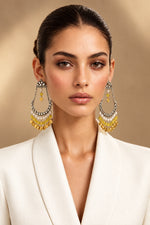 Model wearing Kahani long chandbali earrings with yellow beads, pearl-style accents and gold-tone coin charms.