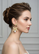 leaf design golden earrings with mother of pearl stone in the bottom leaf by famaza couture