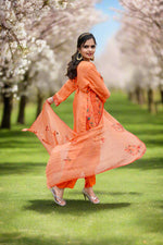 Model wearing orange floral embroidered Pakistani chiffon suit