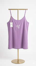 model is showing the purple short tunic rear view.