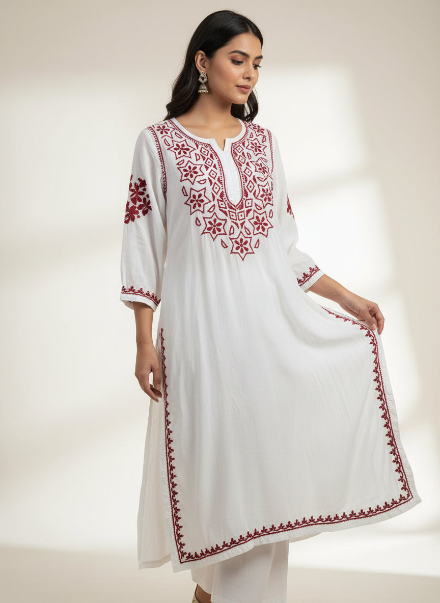 model is wearing white kurti with maroon embroidery