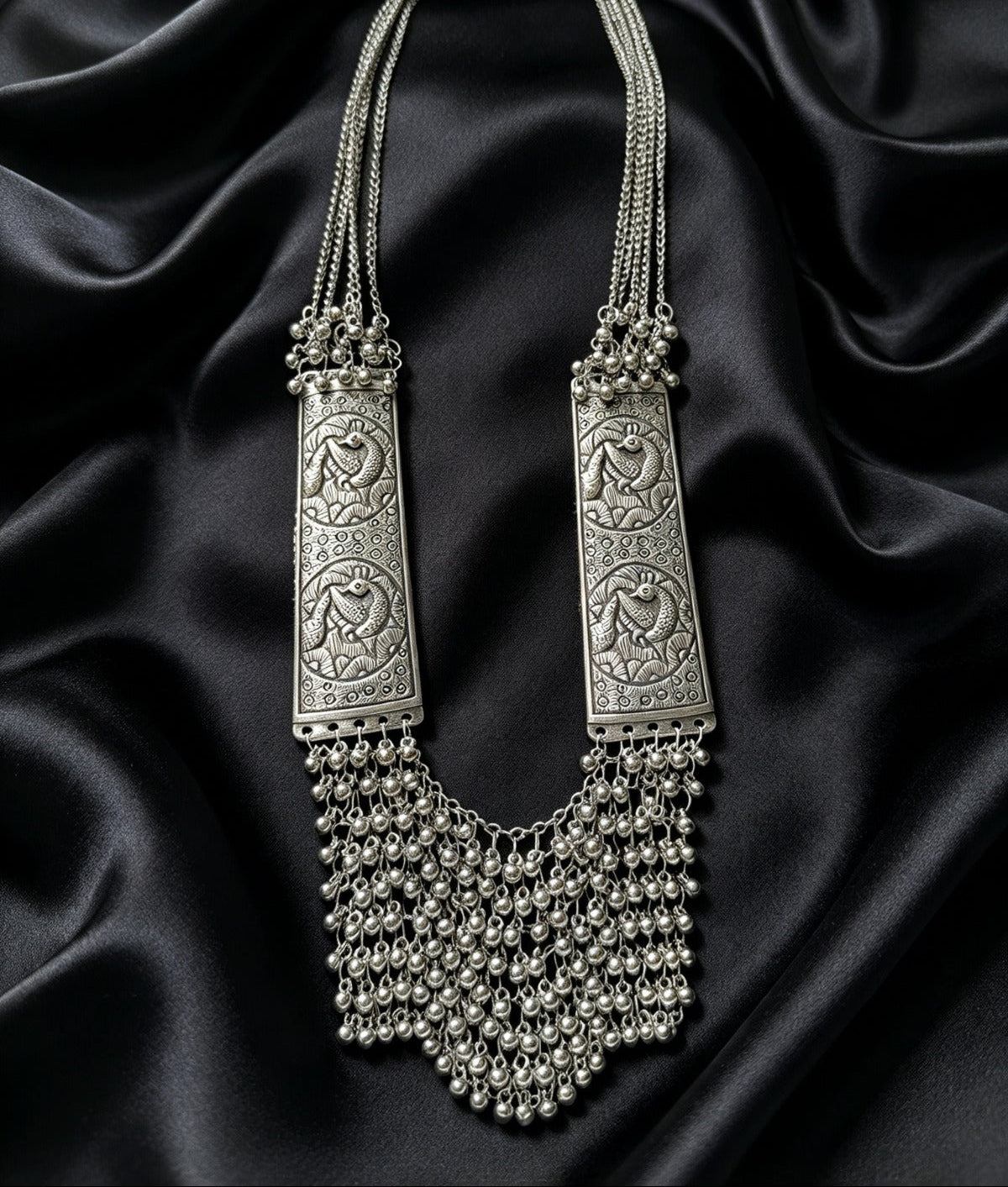 Silver Sonata oxidised peacock long mala necklace with cascading ghungroo fringe on black satin