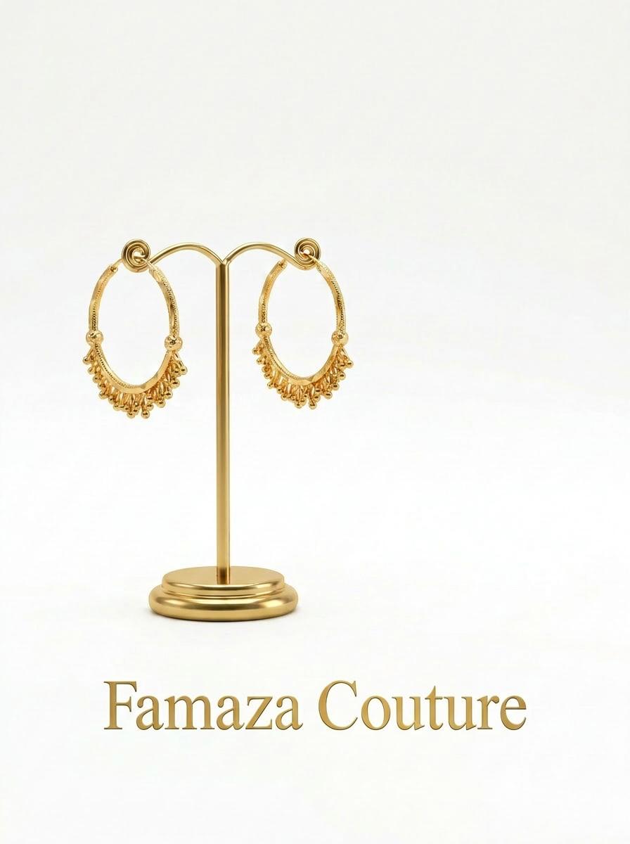 Pair of luxury 18K gold-plated Chand Bali hoop earrings with intricate beaded drops, displayed on a gold stand for Famaza Couture.
