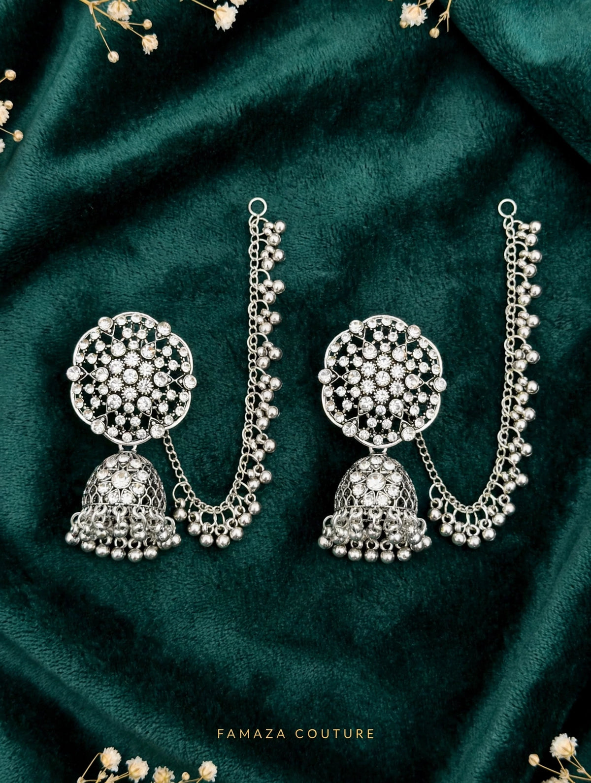 Pakeezah Moonlight silver-tone jhumka earrings with beaded Sahara chains on dark green fabric