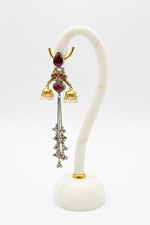 parrot figure golden and black long Kashmiri earrings with mini jhumkas on both sides.