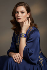 The Persian Royal Blue Sunburst Mosaic openable cuff bracelet by Famaza Couture, showcasing a vintage antique style design.
