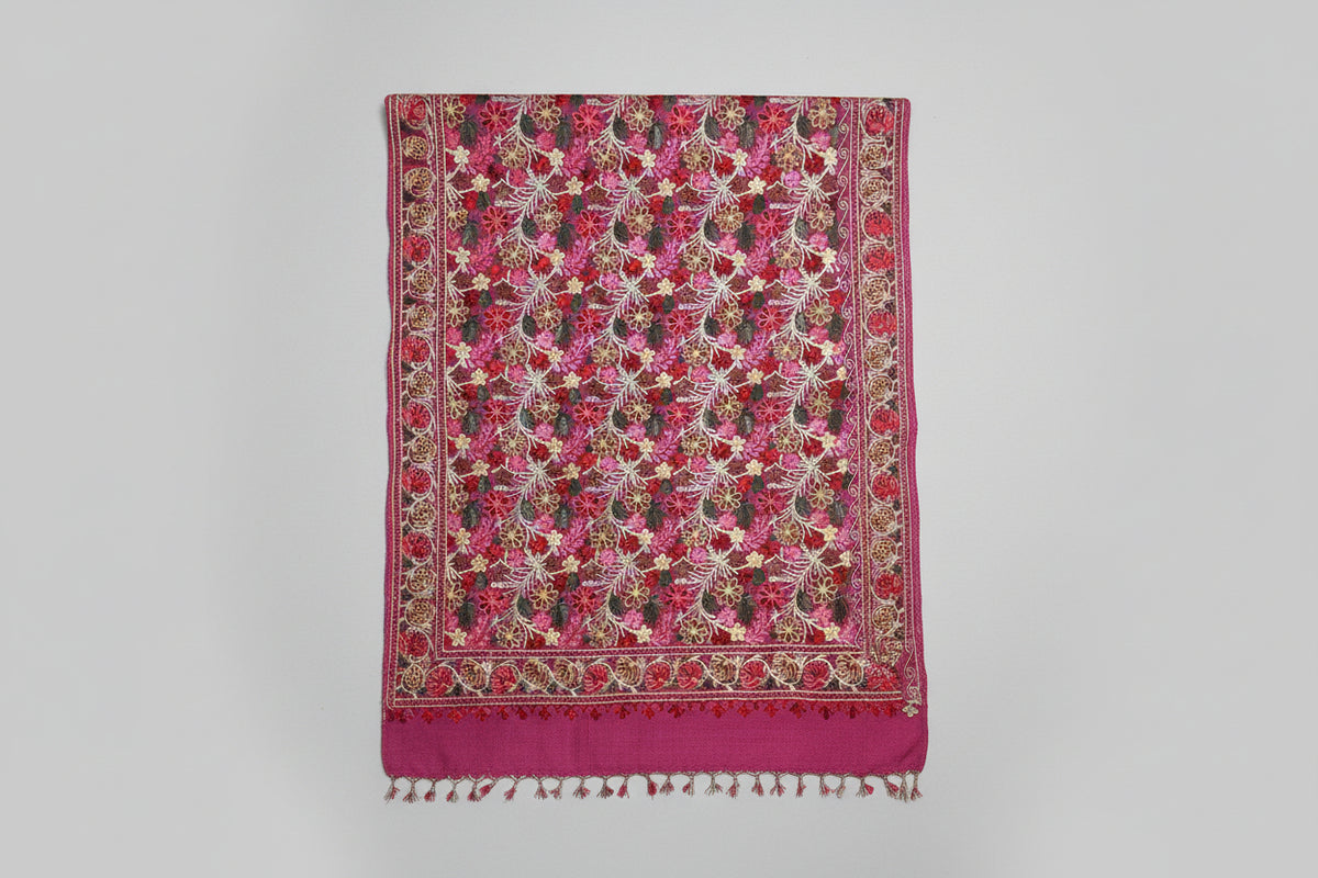 pink Kashmiri embroidered pashmina scarf with a traditional geometric pattern, featuring fringes at the ends.