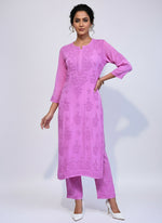 pink colour modal fabric tone to tone hand embroidered kurti and trousers. Kurti is 46 inches long