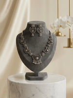 Oxidised choker necklace and stud earrings.