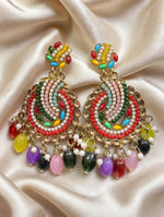 Gold-tone multicolour chandbali earrings on cream satin, with kundan-style detailing, faux pearls and colourful bead drops.