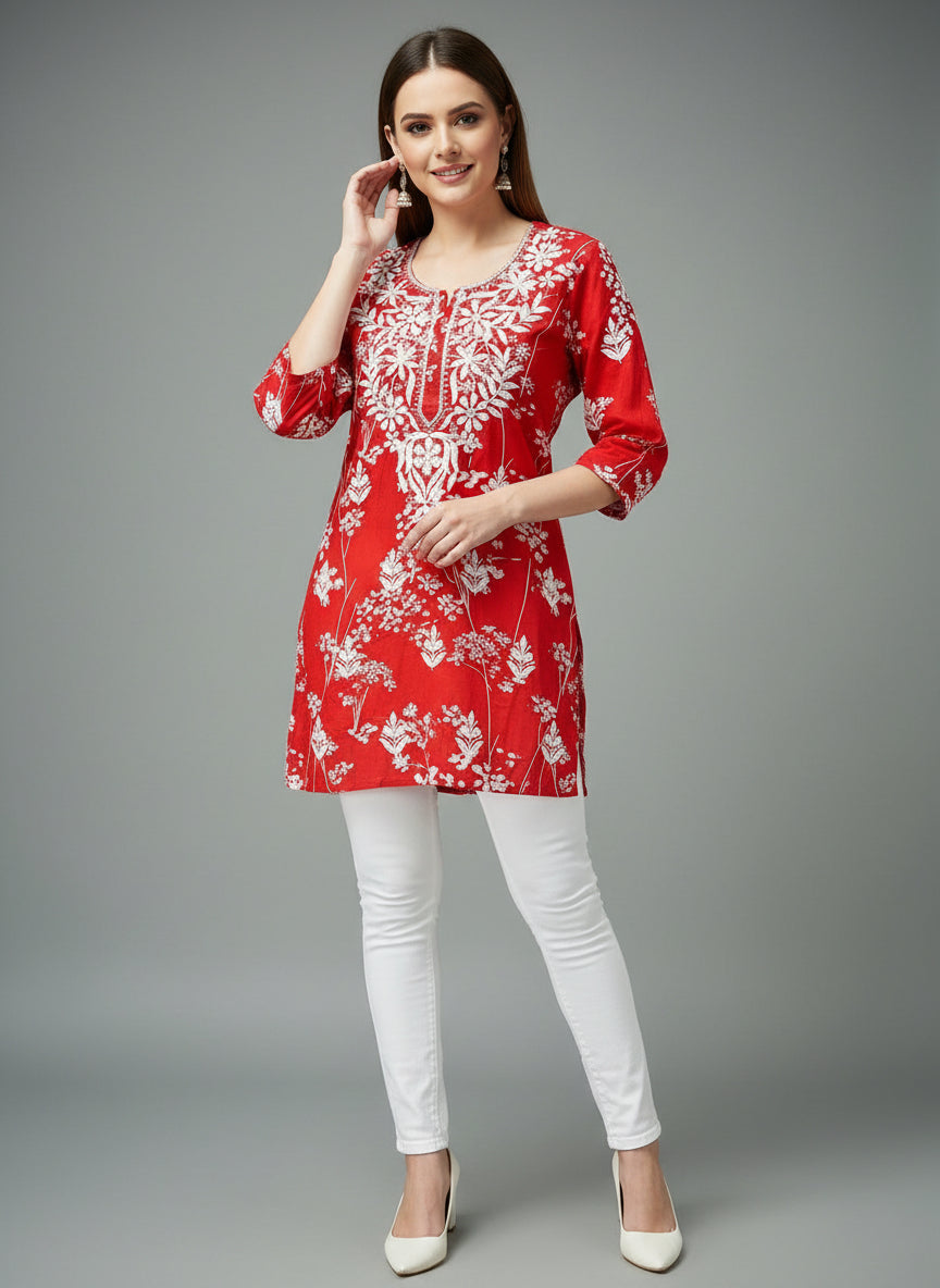 red machine embroidered printed short length kurti with white jeans by famaza couture