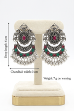 Regal Bloom red and green chandbali earrings on a cream stand, labelled with a 6 cm drop length, 3 cm chandbali width and 7 g weight per earring