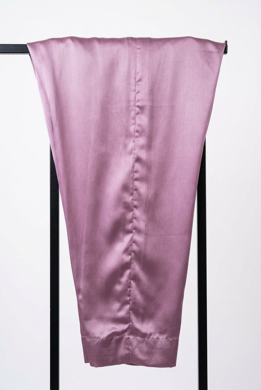 Plain lavender trousers from the Shan-e-Sheeba three-piece suit draped over a black display stand