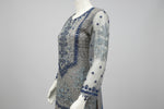side view and showing sleeves work of Net fabric in grey and navy blue two tone 3pcs Pakistani dress with hand embellishments on all over kurti and dupatta with plain grey silk straight trousers