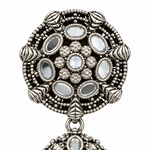 Close-up of the round mirror-work stud on an oxidised silver-tone Bahubali jhumka earring