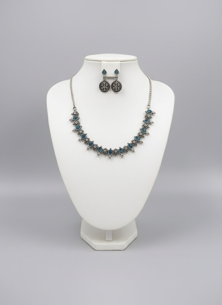silver oxidised Jewellery setincludes necklace and earrings with blue stones in centre by famaza couture