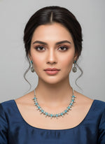 silver oxidised Jewellery set with necklace and earrings with blue stones in centre by famaza couture
