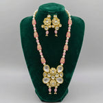 Pink and cream beaded Kundan Rani Mala necklace with a floral pendant and matching earrings on a black bust.