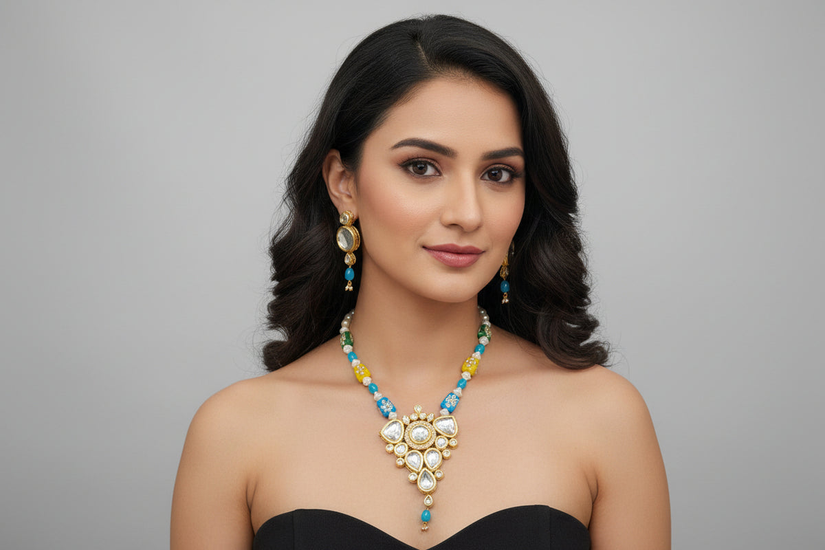 Model wearing a multicoloured beaded Kundan necklace with turquoise-blue accents and matching drop earrings.