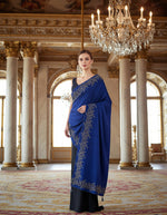 Model wearing a navy velvet scarf with a floral stone-work border.