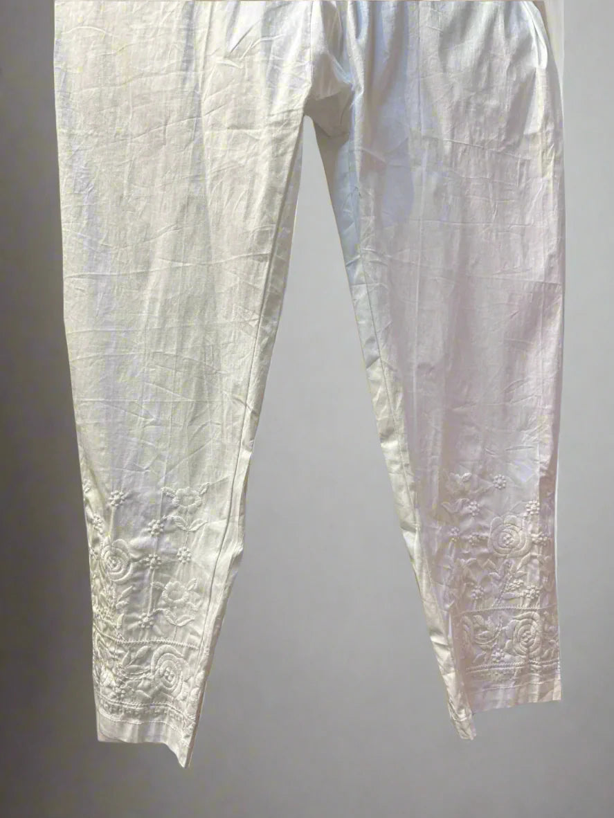 White embroidered cotton pants with floral detailing on cuffs – Famaza Couture