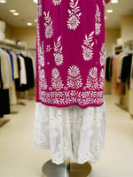 A traditional white Georgette Gharara with Chikankari hand embroidery displayed on a mannequin. The bottom flare has kaamdani work details.