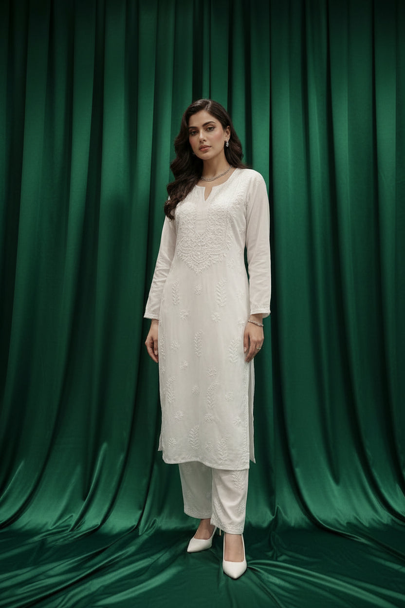 Close-up of the intricate silk thread Ghaspatti embroidery on the back of the white rayon Chikankari kurti by Famaza Couture.