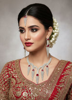 white American diamonds with Red ruby imitation Silver cascade CZ statement necklace earring and tikka set Famaza Couture