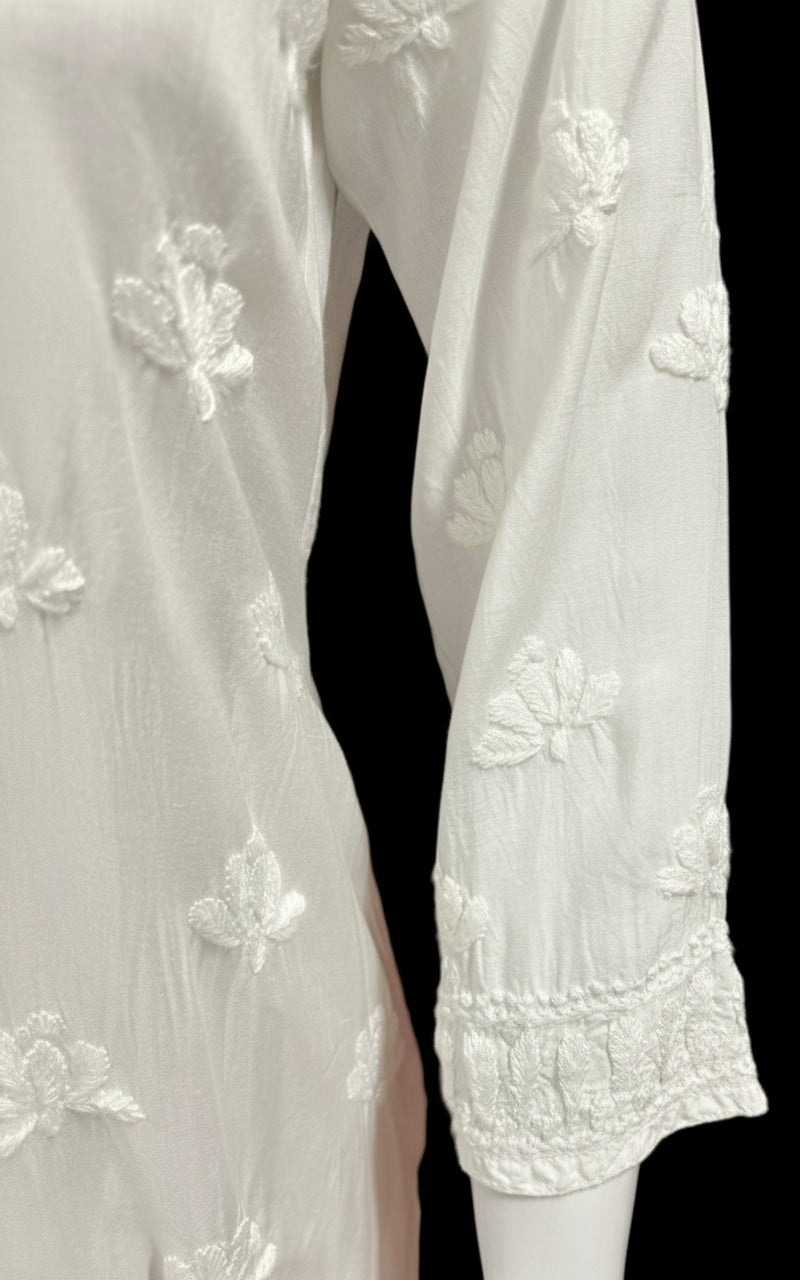 whiteMuslin fabricwith collar Chikankari short length kurti and three buttons on the front, featuring intricate ghasspati hand embroidery with floral motifs by famaza couture