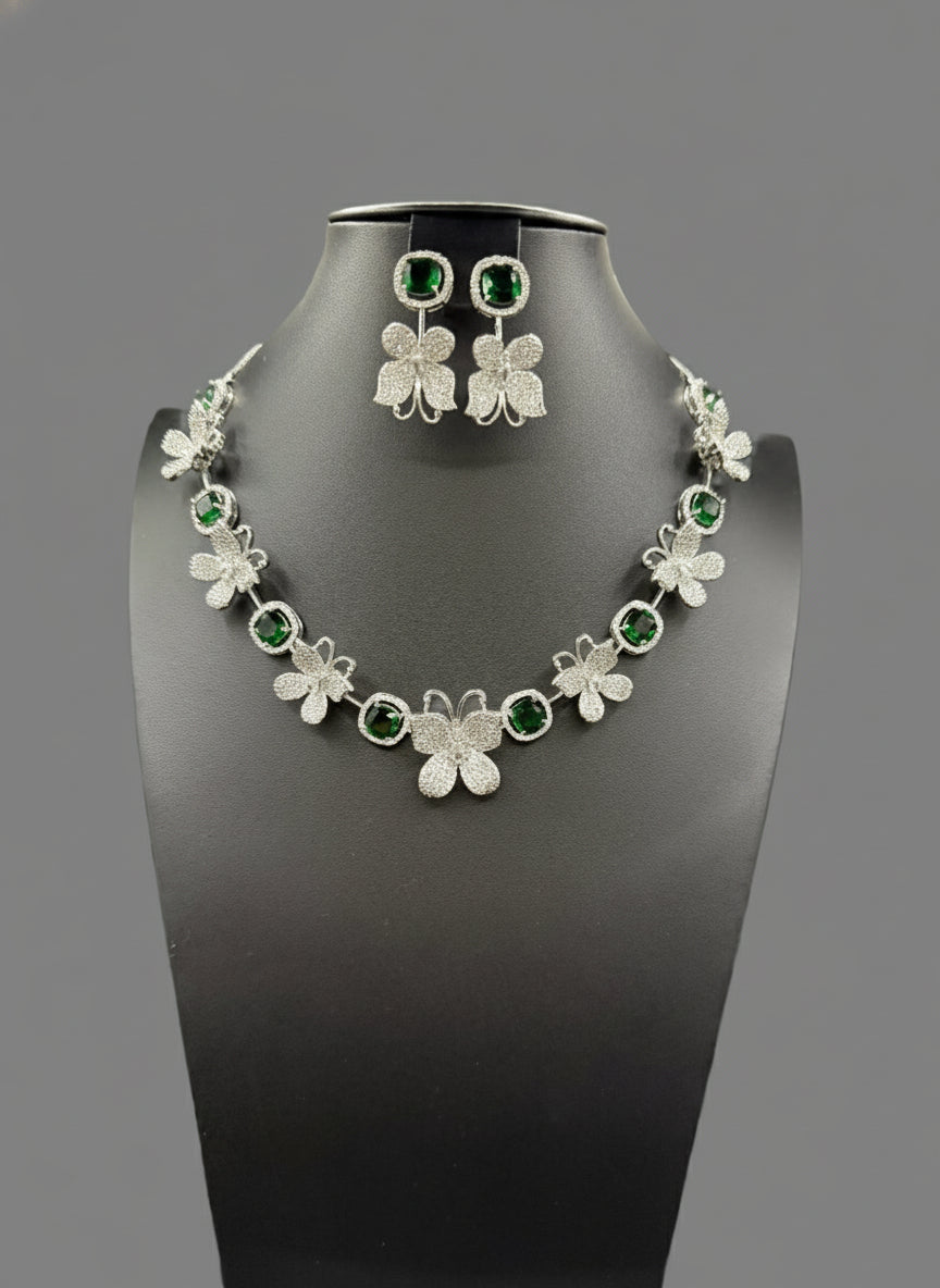 white Nano American diamonds and emerald green central stone earrings by famaza couture