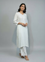 White colour rayon fabric plus size kurti and trousers with white thread chikankari embroidery on the kurti and trousers.
