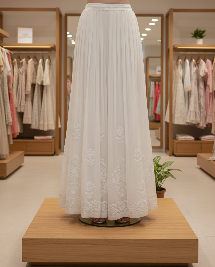 white modal fabric with silk thread chikankari embroidery by famaza couture