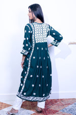 Woman wearing the naira cut gown style Chikankari kurti top rear view with elegant embroidery work