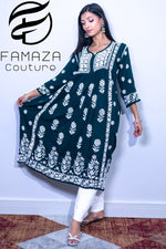 Woman wearing the naira cut gown style Chikankari kurti top with elegant embroidery work