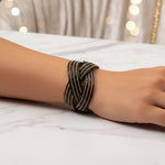 Handmade black and gold glass beaded cuff bracelet for women.