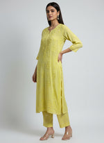 yellow colour modal fabric tone to tone hand embroidered kurti and trousers. Kurti is 46 inches long